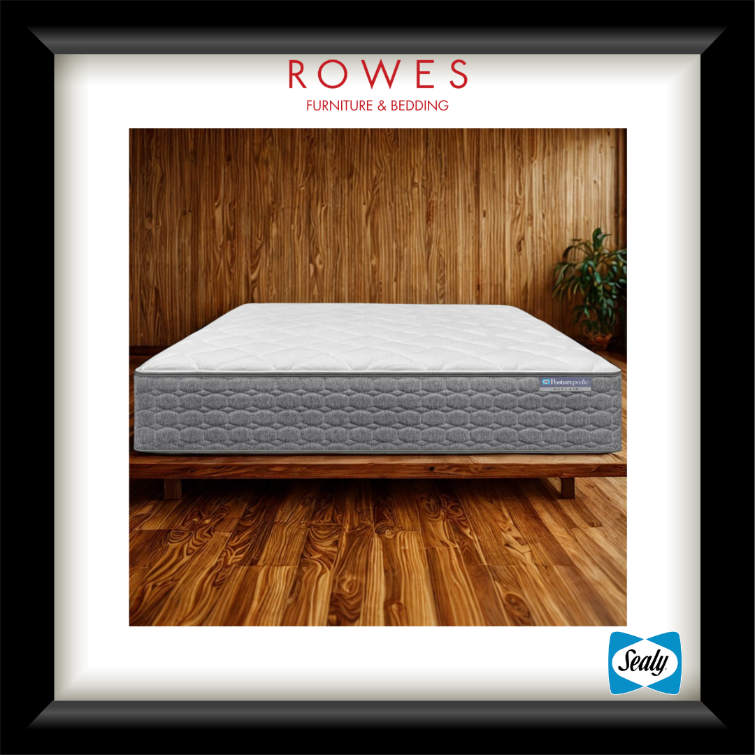 Gray mattress on a wooden bed frame with 'Rowes Furniture & Bedding' branding.