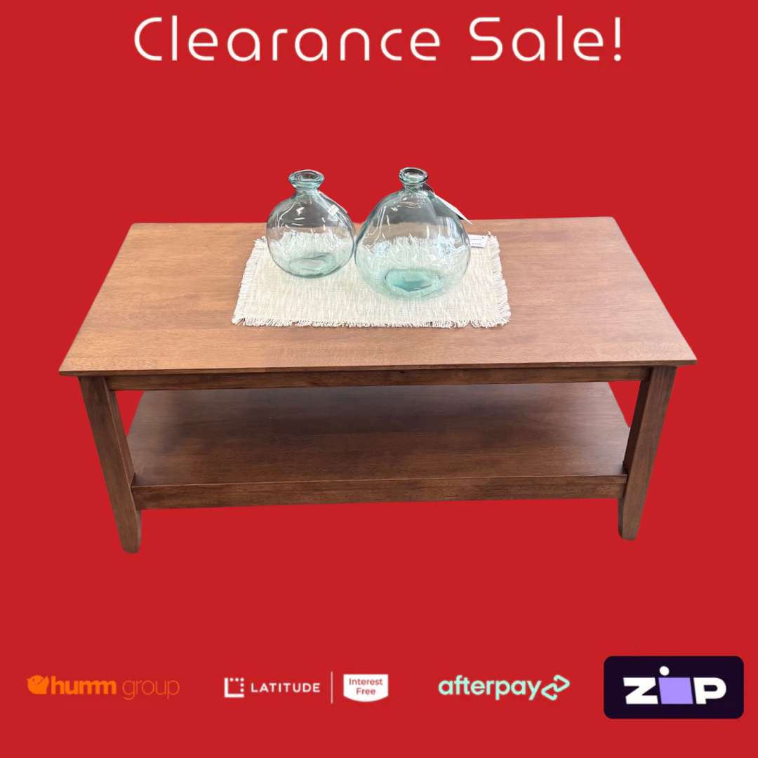 Wooden table with two glass jars on a red background with clearance sale text