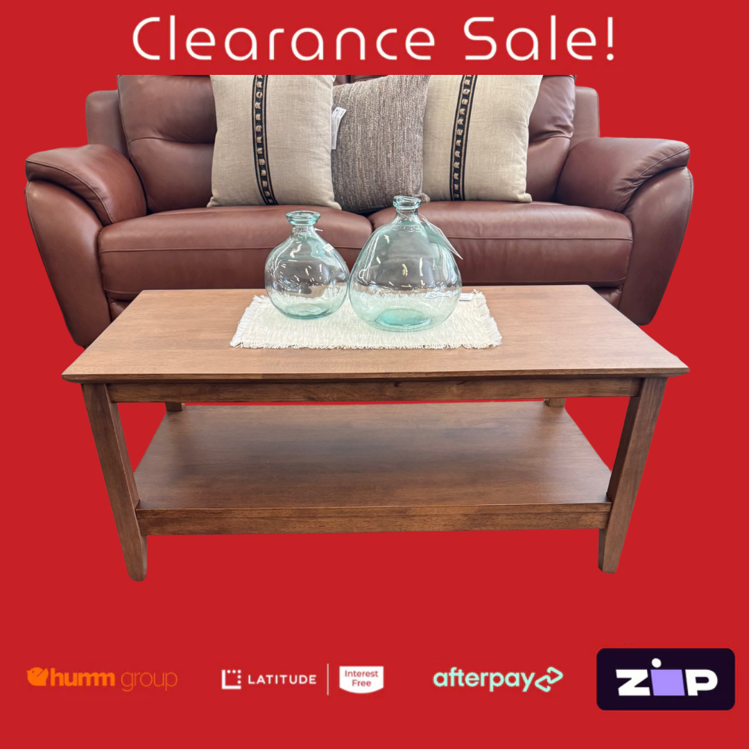 Brown leather sofa with a wooden coffee table and decorative items on a red background, featuring clearance sale text and payment logos.
