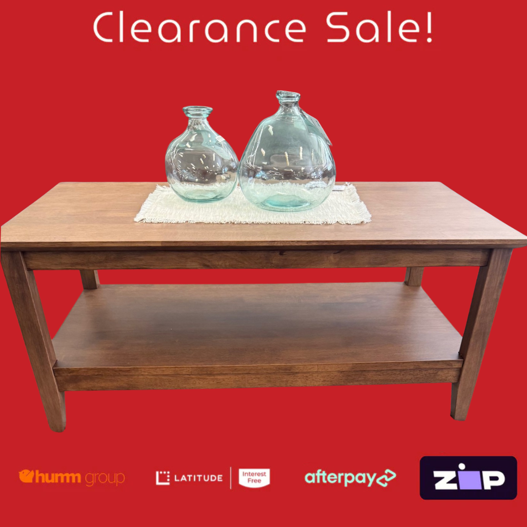 Wooden coffee table with two glass jars on a red background with 'Clearance Sale!' text.