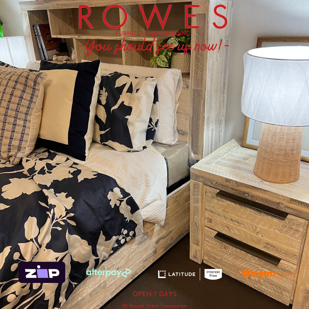 Bedroom setup with floral bedding, wooden furniture, and 'Rowes' branding.