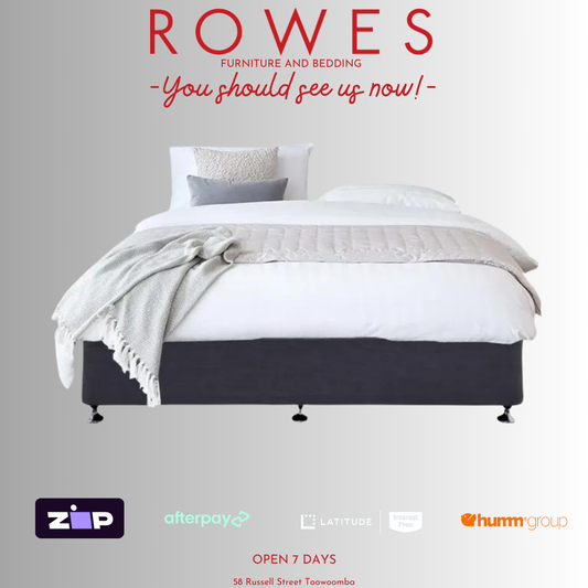 A designer bed base with a contemporary upholstered fabric finish in a bedroom setting, with branding and payment options visible.