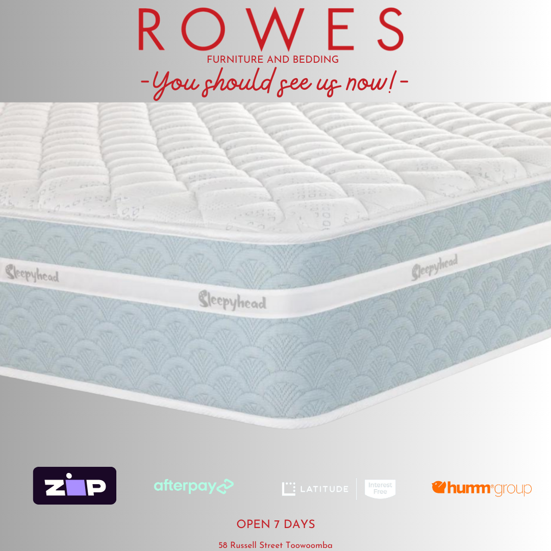 The image shows the top view of a white mattress with branding labels indicating the store 'Rowes - You should see us now!'. It also features logos for 'BedsRus' and 'Afterpay'.