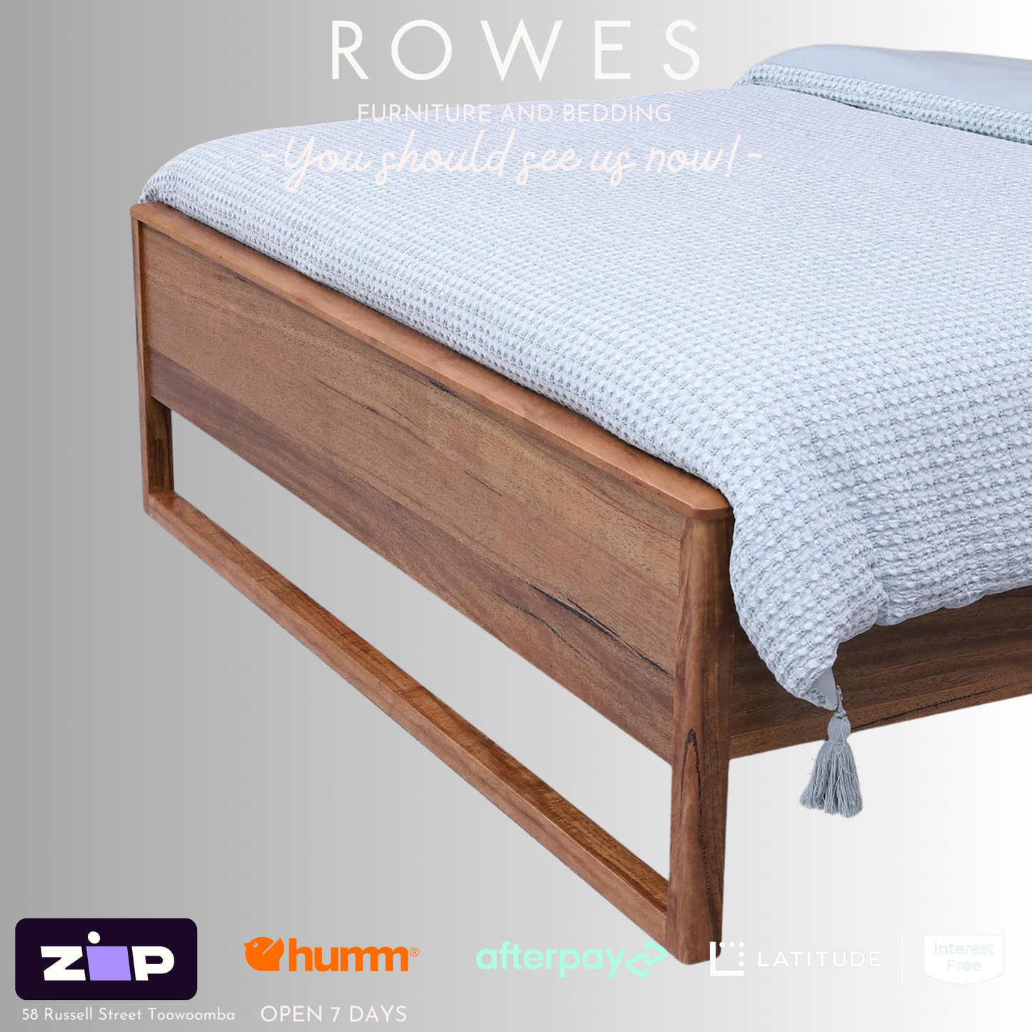 A Freemantle bed made of Western Australian Marri timber with a white and blue bedsheet, featuring integrated LED lights and USB charging ports on the bedhead.