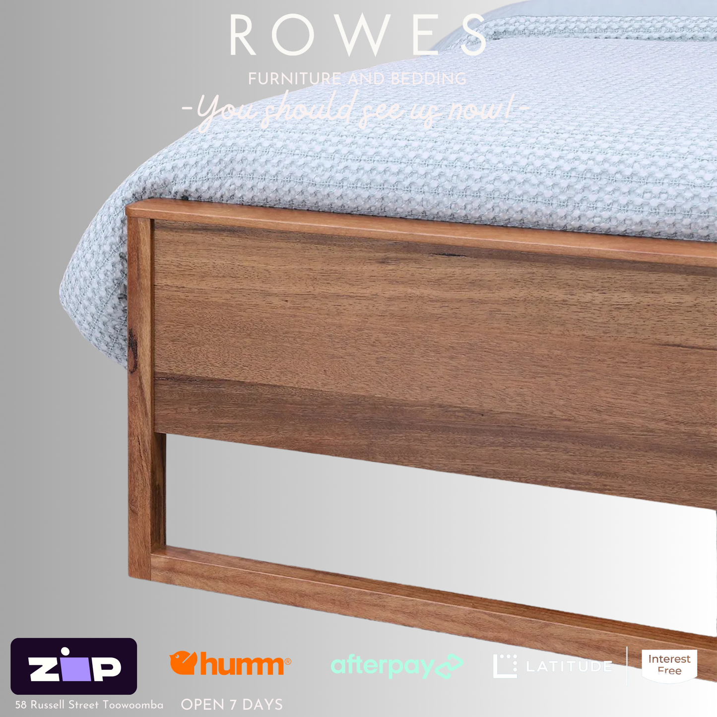 A Freemantle bed made of Western Australian Marri timber with a white and blue bedsheet, featuring integrated LED lights and USB charging ports on the bedhead.