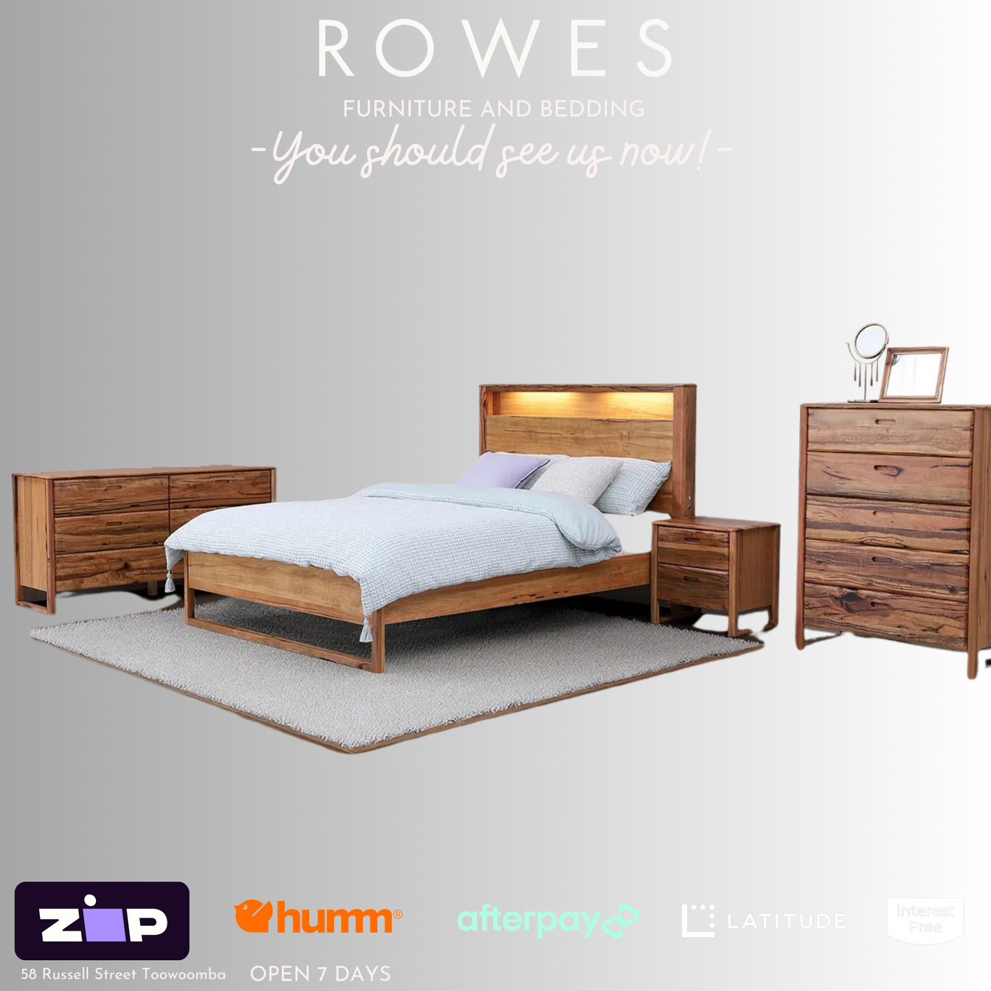 A Freemantle bed made of Western Australian Marri timber with a white and blue bedsheet, featuring integrated LED lights and USB charging ports on the bedhead.