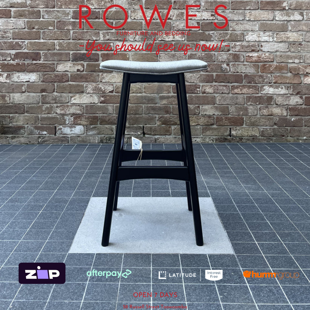 Black bar stool on a gray floor with a brick wall background, featuring the brand 'Rowes'.