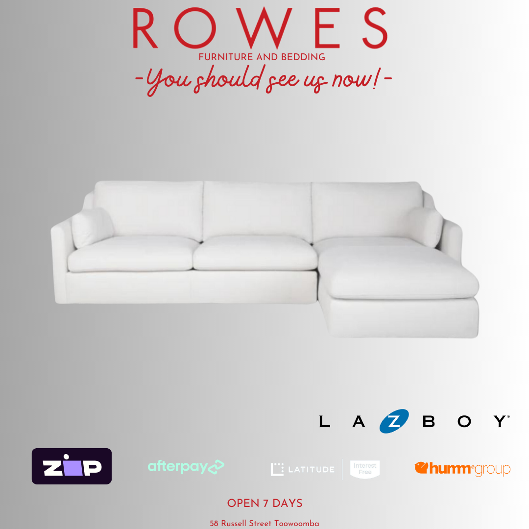 A LaZboy Huntington sofa set, featuring a white color scheme, a streamlined silhouette, and sloped arm detailing.