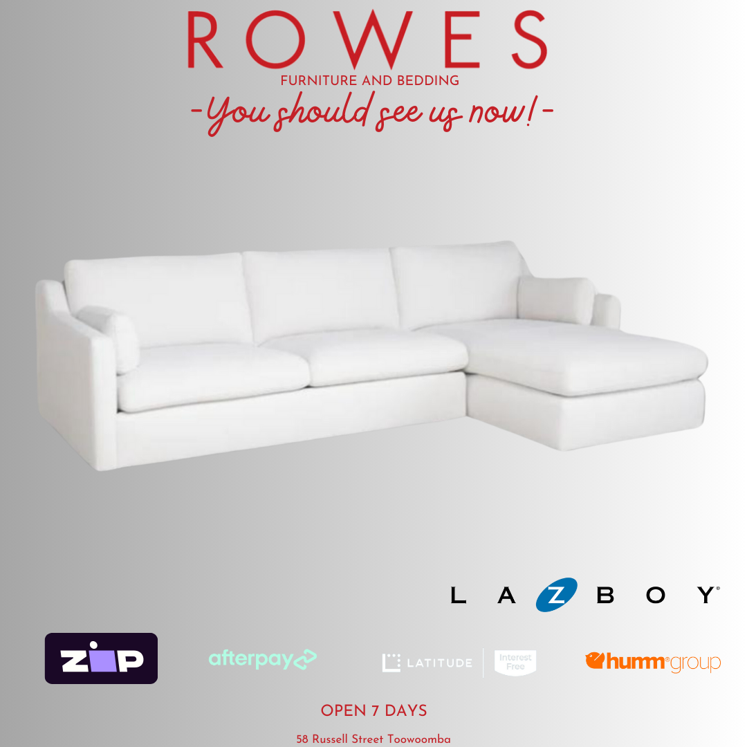 A LaZboy Huntington sofa set, featuring a white color scheme, a streamlined silhouette, and sloped arm detailing.