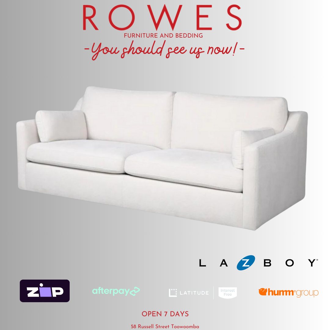A LaZboy Huntington sofa set, featuring a white color scheme, a streamlined silhouette, and sloped arm detailing.