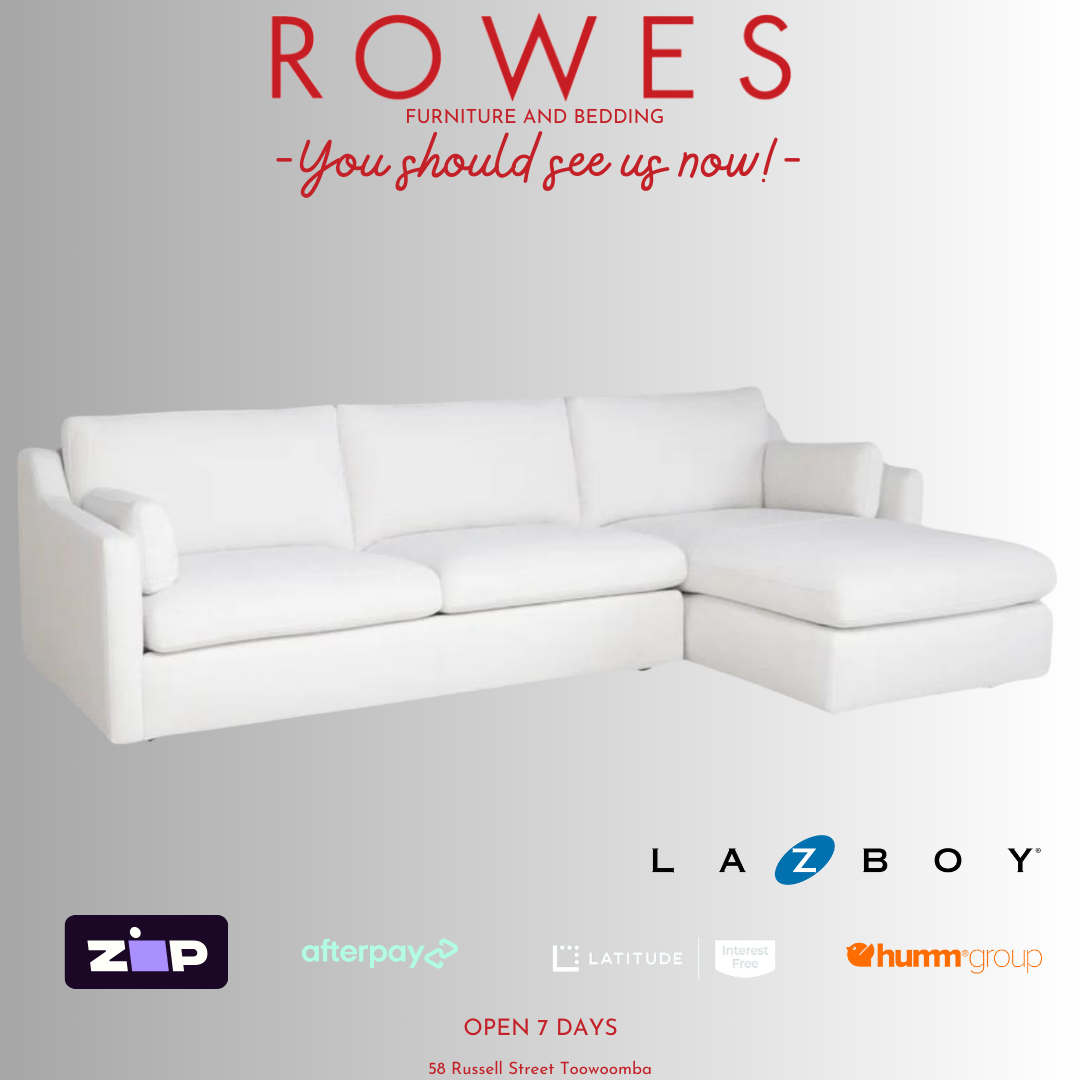 A LaZboy Huntington sofa set, featuring a white color scheme, a streamlined silhouette, and sloped arm detailing.