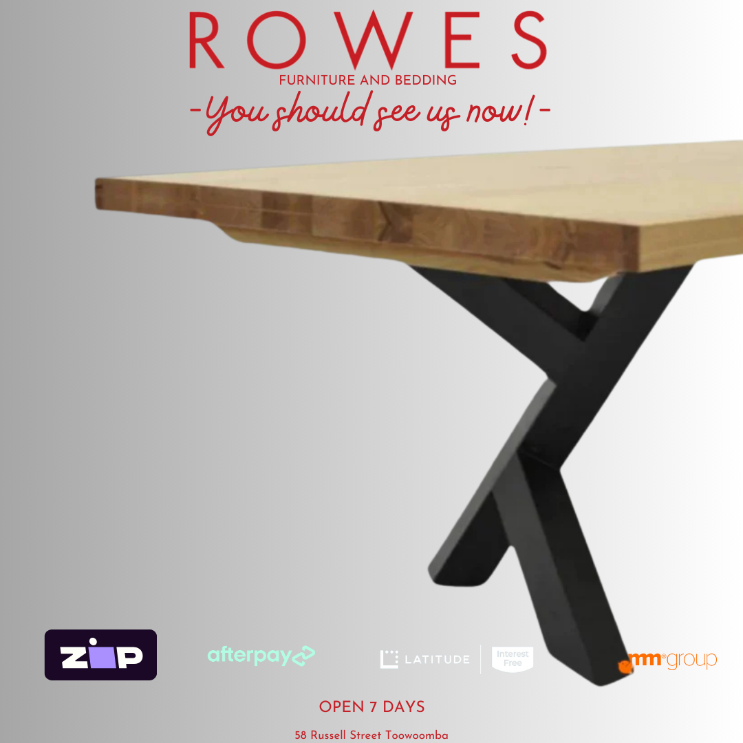 A promotional image of the Metallico dining table with a thick Messmate timber tabletop and a unique metal leg pair in a gloss finish.