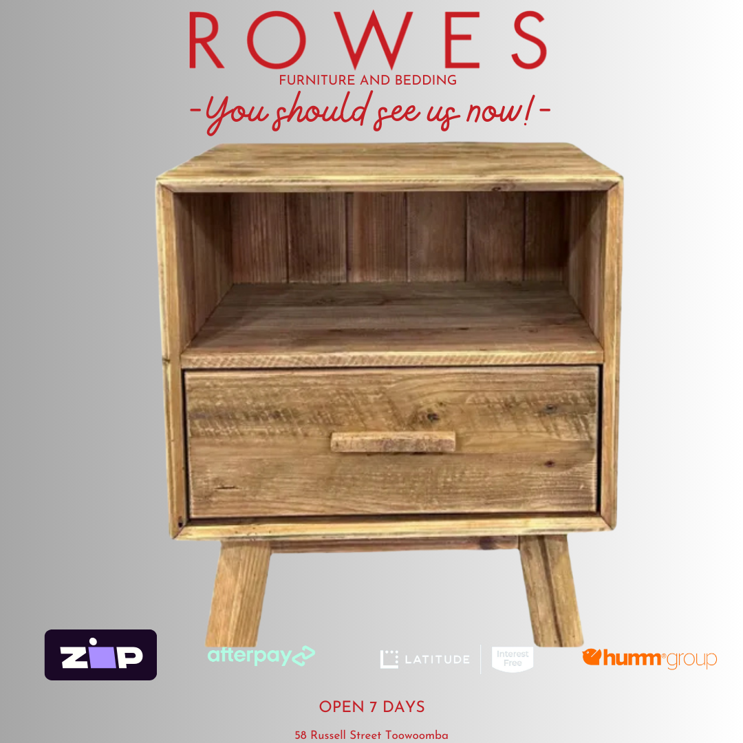 A chunky recycled pine bedside table with one drawer and one niche, featuring a natural wood finish.