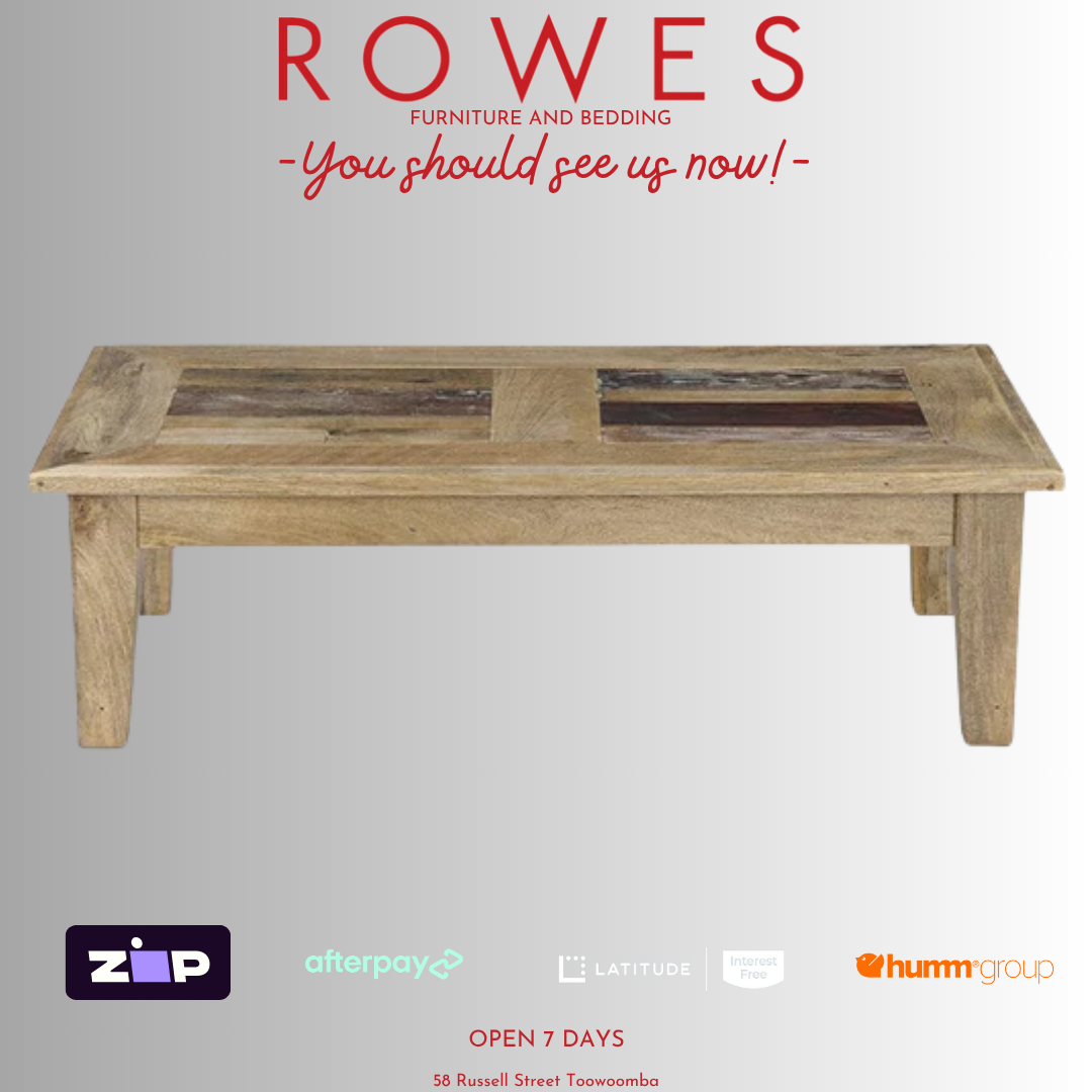 Wooden table with 'Rowes Furniture and Bedding' advertisement on a gray background