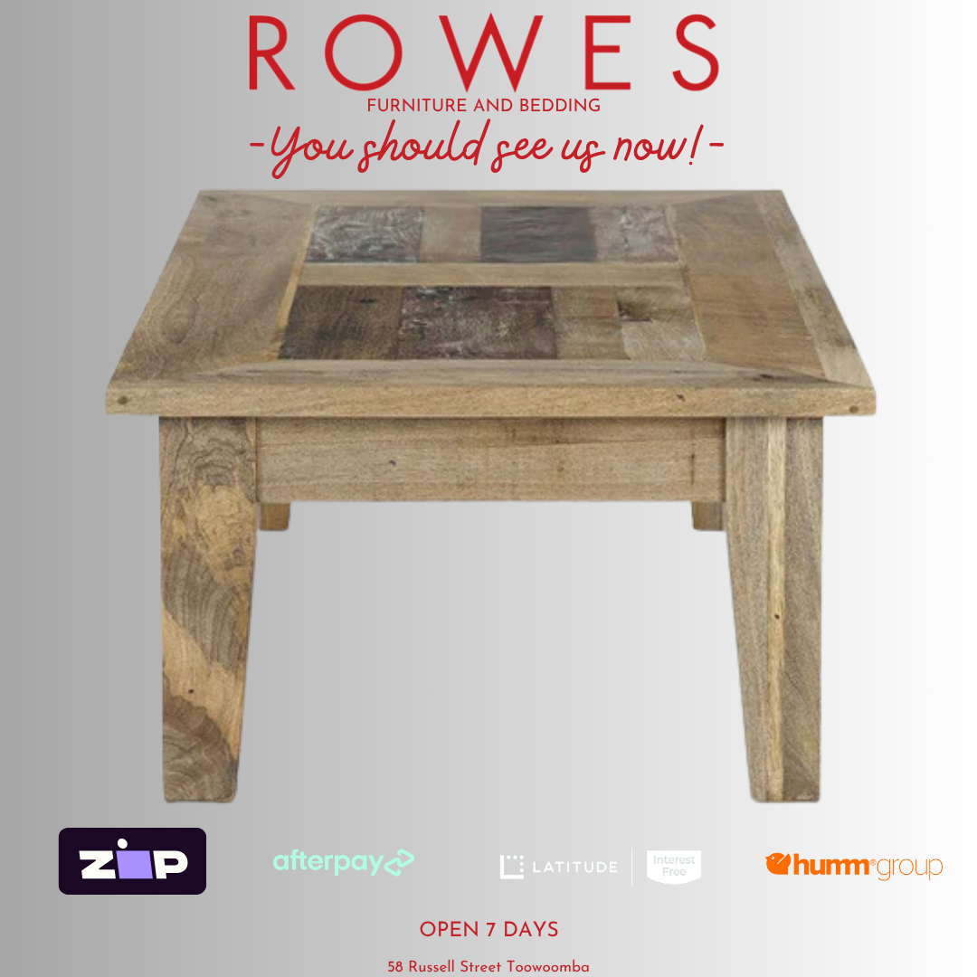 Wooden table with 'Rowes Furniture and Bedding' advertisement on a gray background
