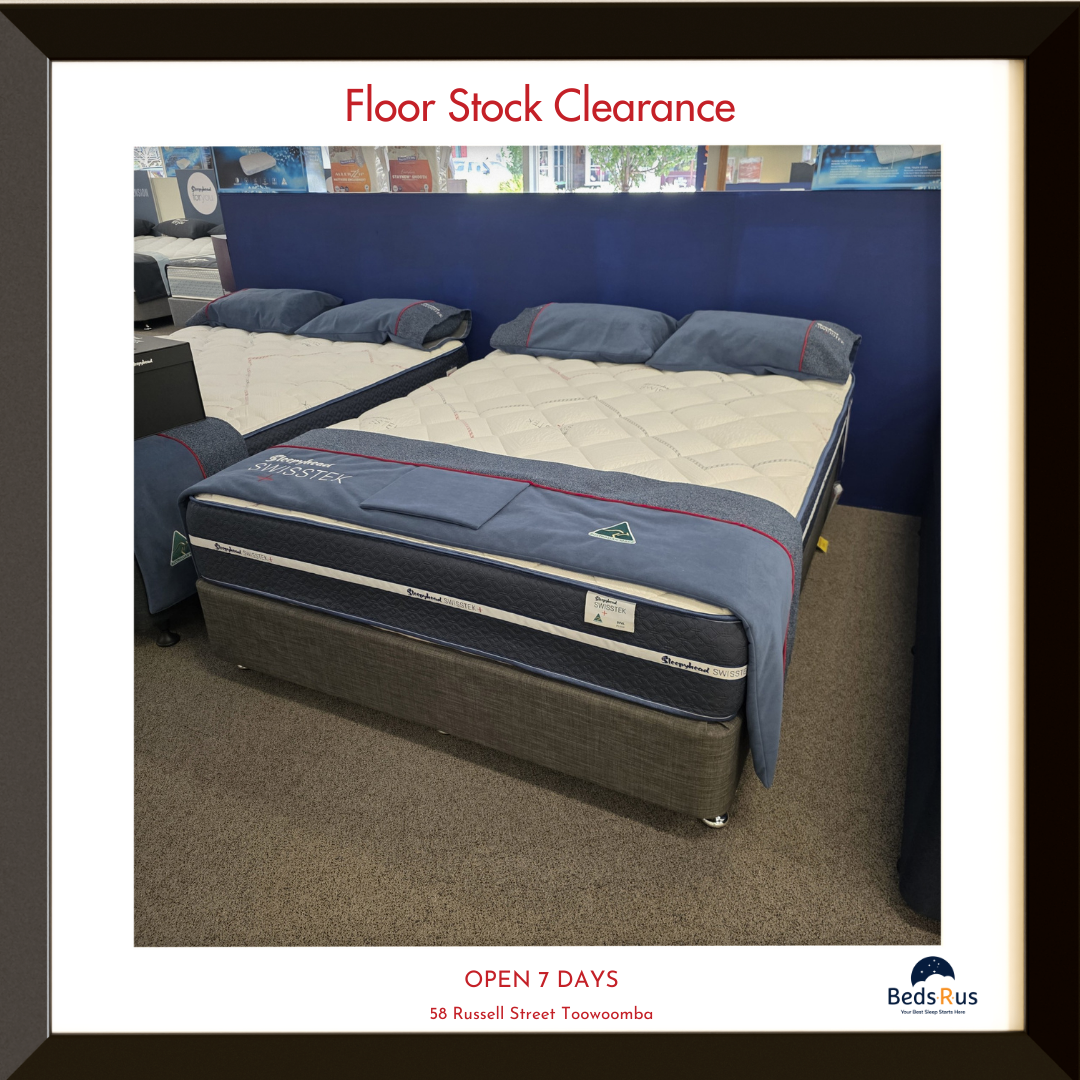 Mattress on display with 'Floor Stock Clearance' text and Beds R Us branding.