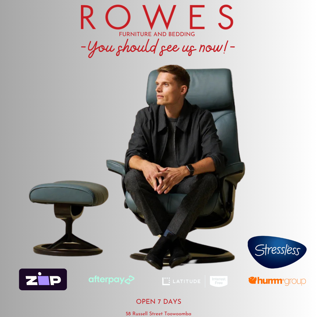 Man sitting on a modern recliner chair with 'Rowes Furniture and Bedding' advertisement in the background.
