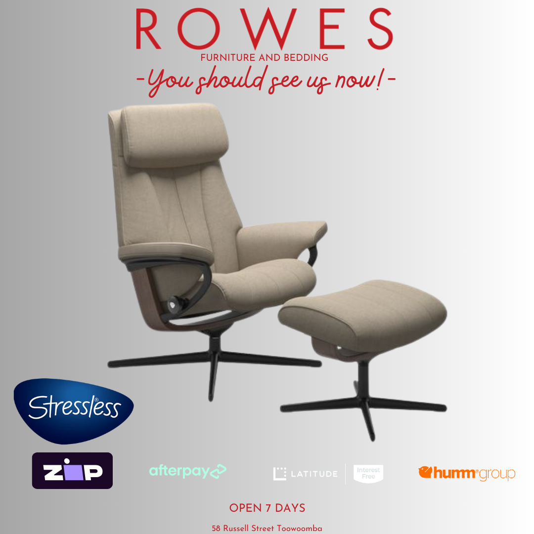 Beige recliner chair with ottoman on a gray background, featuring the Stressless brand.