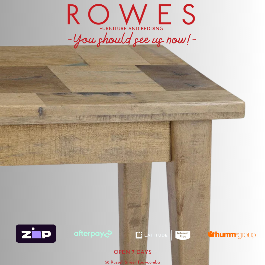 Wooden table with 'Rowes Furniture and Bedding' advertisement on a white background