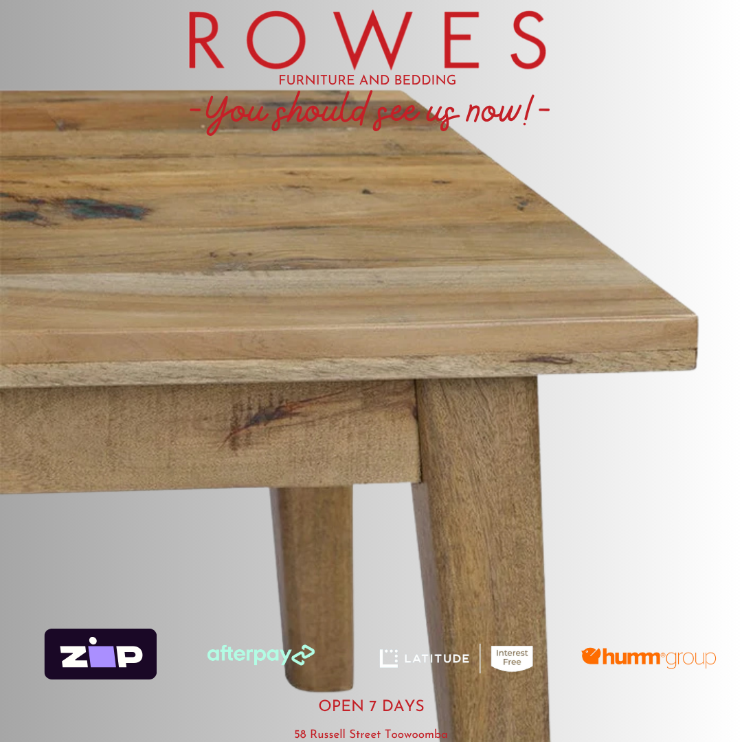 Wooden table with 'Rowes Furniture and Bedding' advertisement on a white background
