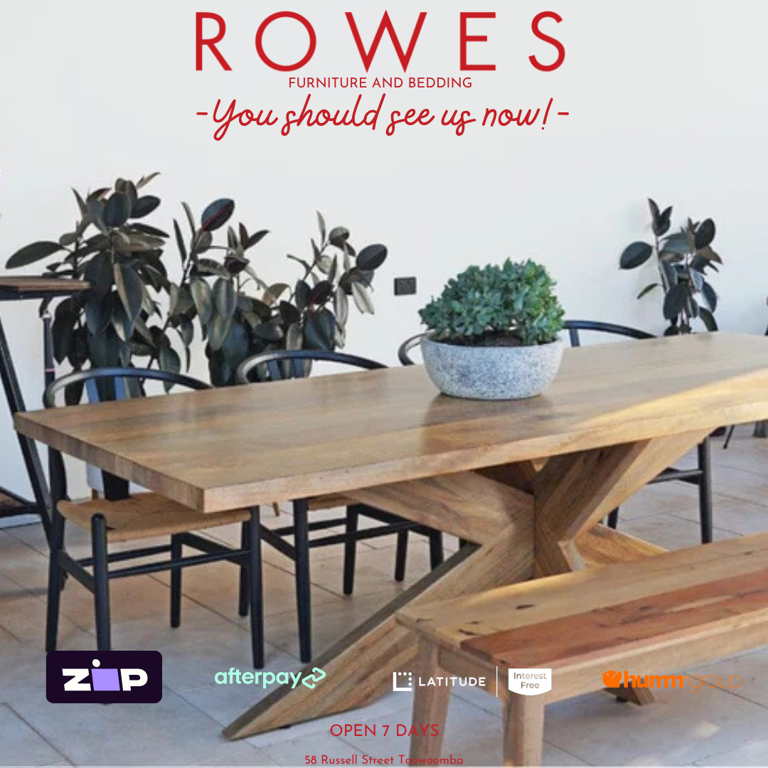 Wooden dining table with chairs and plants in a room, featuring promotional text and logos.