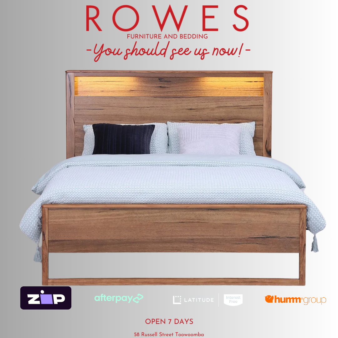A Freemantle bed made of Western Australian Marri timber with a white and blue bedsheet, featuring integrated LED lights and USB charging ports on the bedhead.