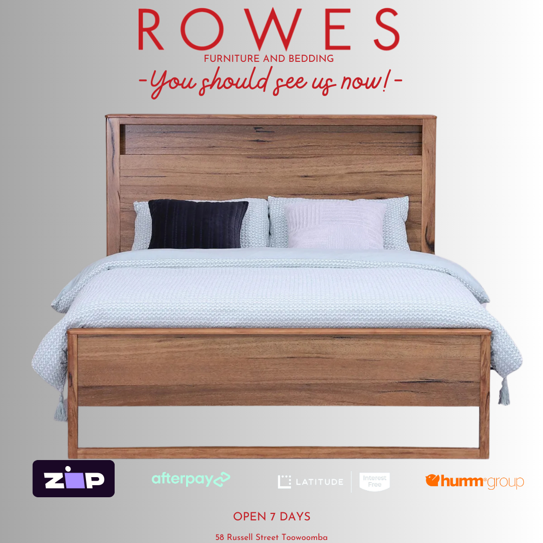 A Freemantle bed made of Western Australian Marri timber with a white and blue bedsheet, featuring integrated LED lights and USB charging ports on the bedhead.