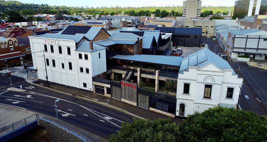 A large white building with ROWES logos 