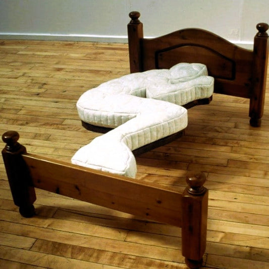Bed shaped like a person on a timber floor