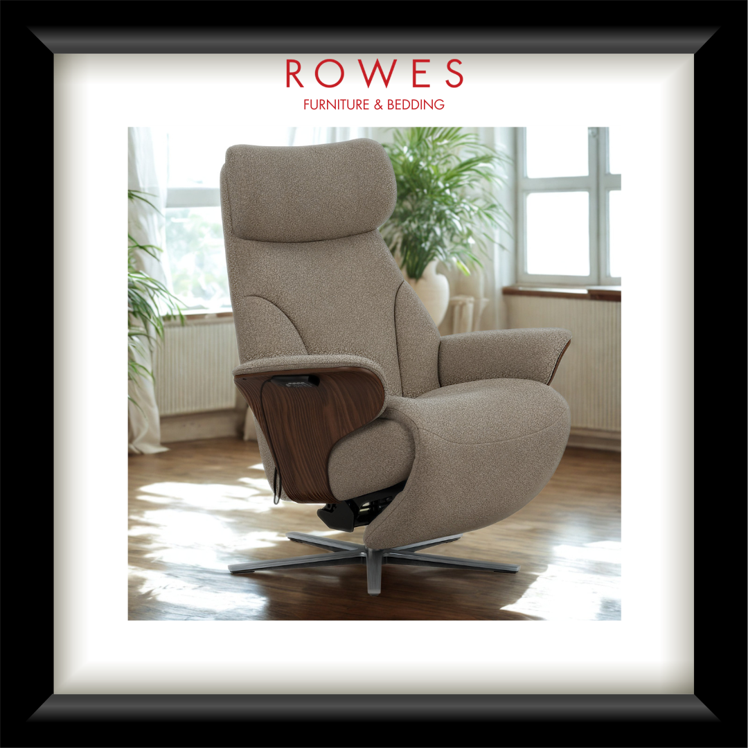 Beige recliner chair with wooden armrests in a room with large windows and plants, featuring the Rowes Furniture & Bedding logo.