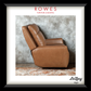 A framed print featuring a tan leather recliner chair against a textured gray wall, with the text 'ROWES FURNITURE & BEDDING' at the top and 'LaZboy' at the bottom. The print is matted with a white border and enclosed in a black frame.