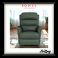 Green recliner chair in a room with plants and curtains, featuring Rowes Furniture & Bedding logo.