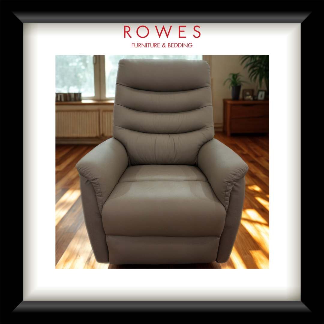 Gray recliner chair in a room with wooden floor and window, branded 'Rowes Furniture & Bedding'.