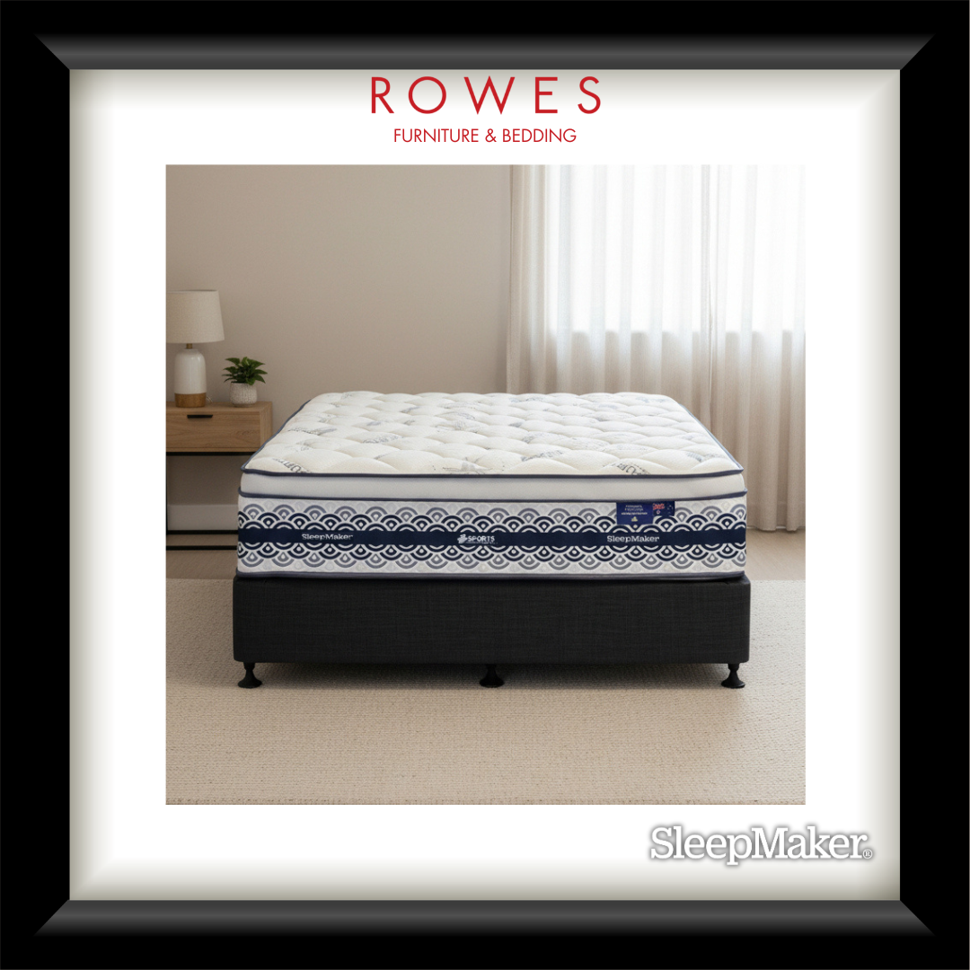 Mattress with decorative pattern on a bed frame, branded as SleepMaker, in a room setting.