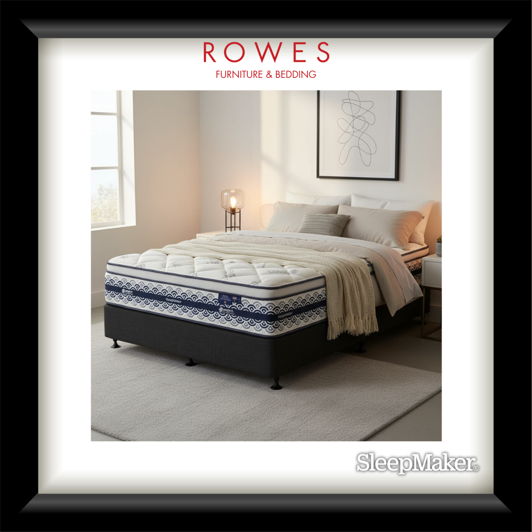 Bed with white bedding and blue accents in a bedroom setting, featuring Rowes Furniture & Bedding branding.