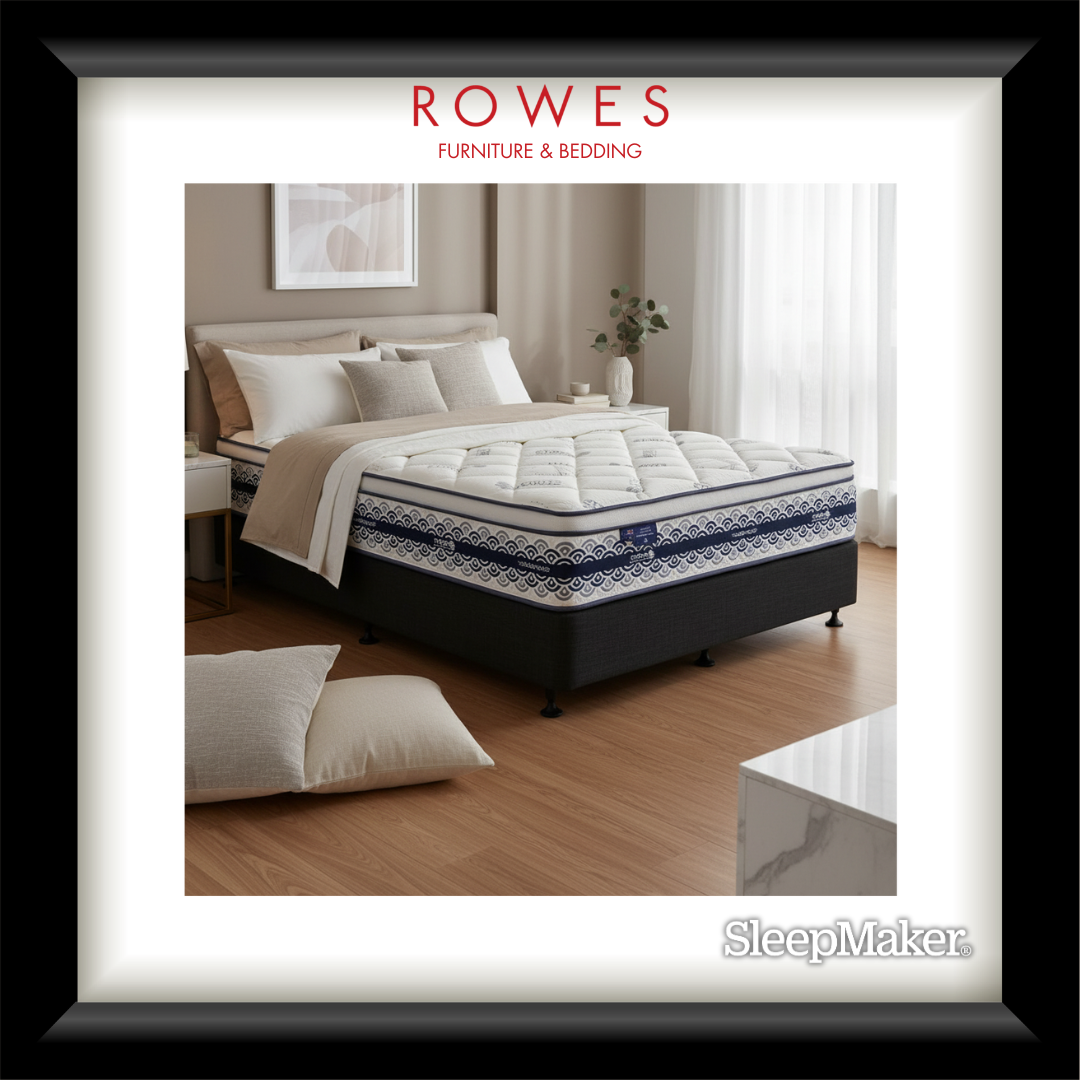 Bed with white bedding and pillows in a bedroom setting, featuring Rowes Furniture & Bedding branding.