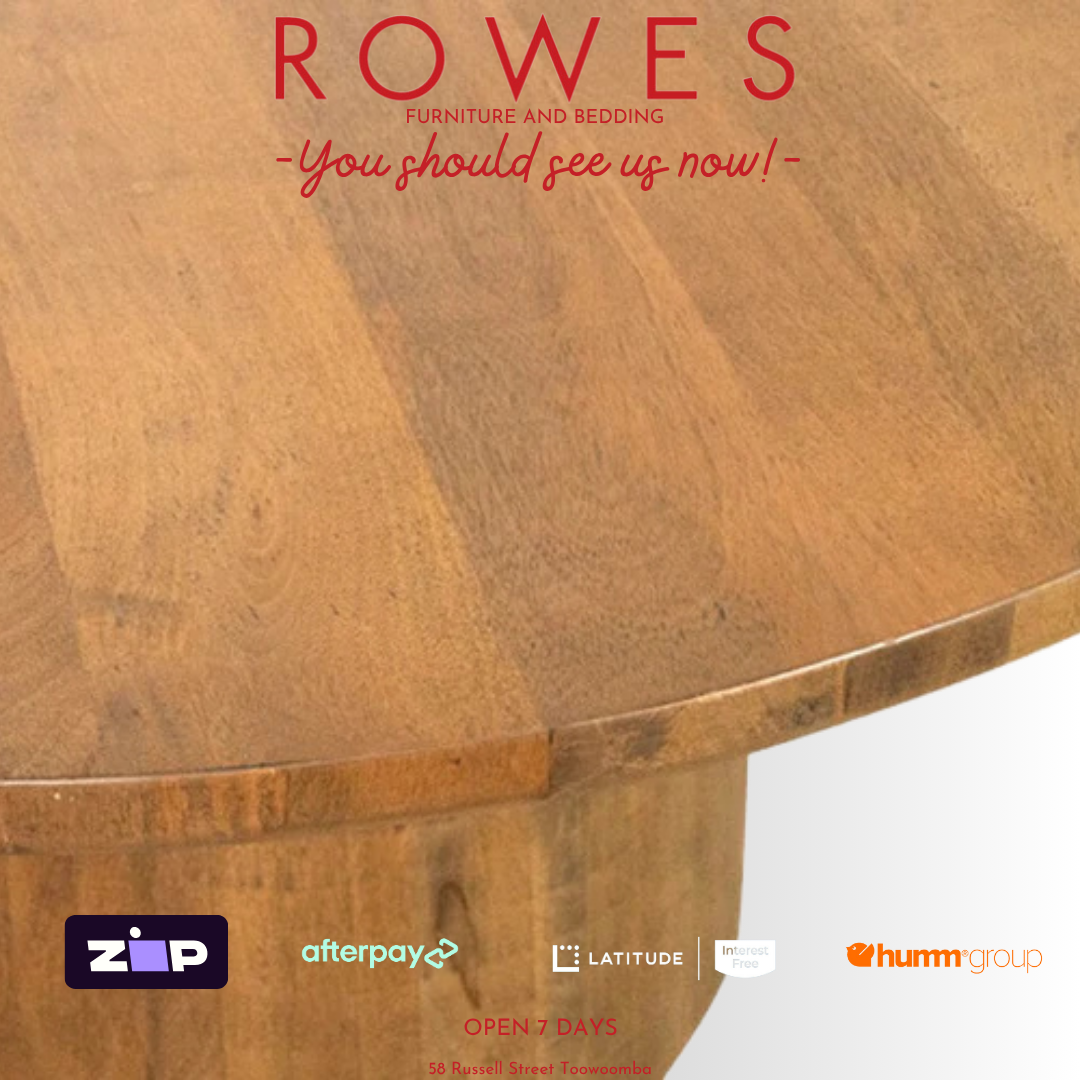 Wooden table with 'Rowes Furniture and Bedding' advertisement on a white background