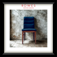 A framed print or poster featuring a dark blue upholstered wooden chair against a textured concrete wall and wood floor. The print is matted with a white border and enclosed in a black frame.