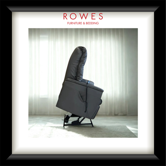 Gray recliner chair in a room with white curtains, branded as Rowes Furniture & Bedding.