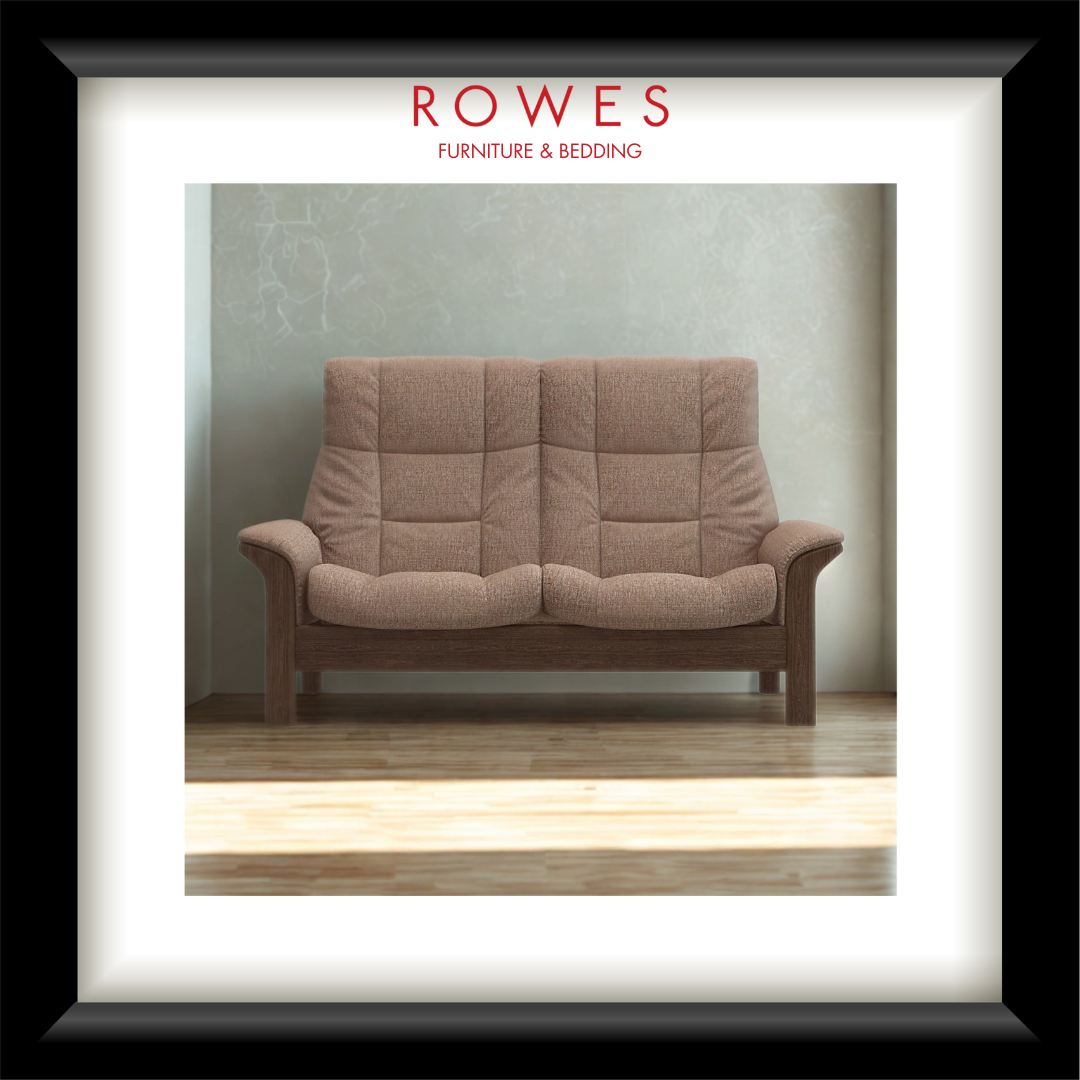 Brown sofa in a room with 'Rowes Furniture & Bedding' branding.