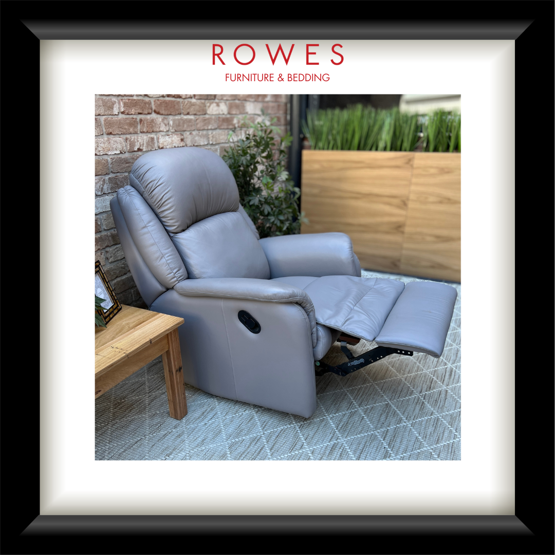 Gray recliner chair in an outdoor setting with 'Rowes Furniture & Bedding' branding.