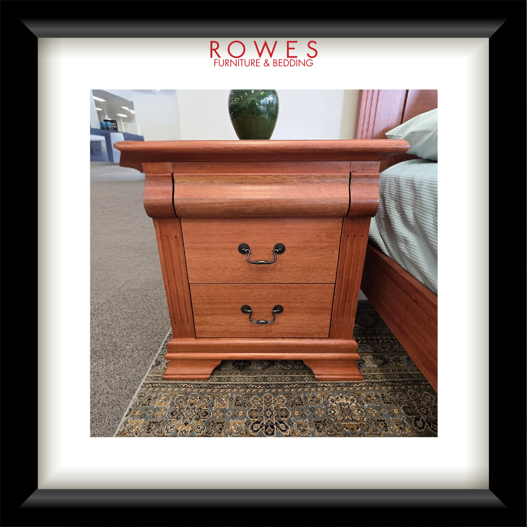 Wooden nightstand with two drawers in a bedroom setting, featuring the Rowes Furniture & Bedding logo.