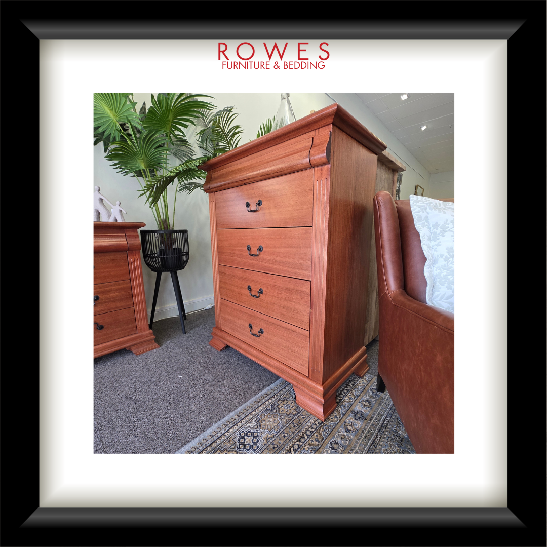 Wooden dresser in a room with furniture and decor, featuring Rowes Furniture & Bedding logo.