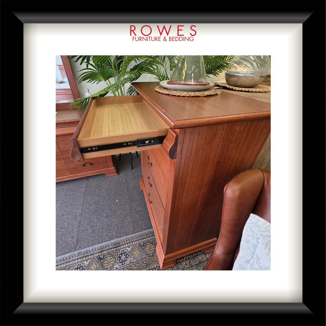 Wooden desk with a tray pulled out, featuring Rowes Furniture & Bedding logo.
