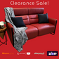 Red leather sofa with a blanket and pillows on a red background, featuring clearance sale text and payment logos.