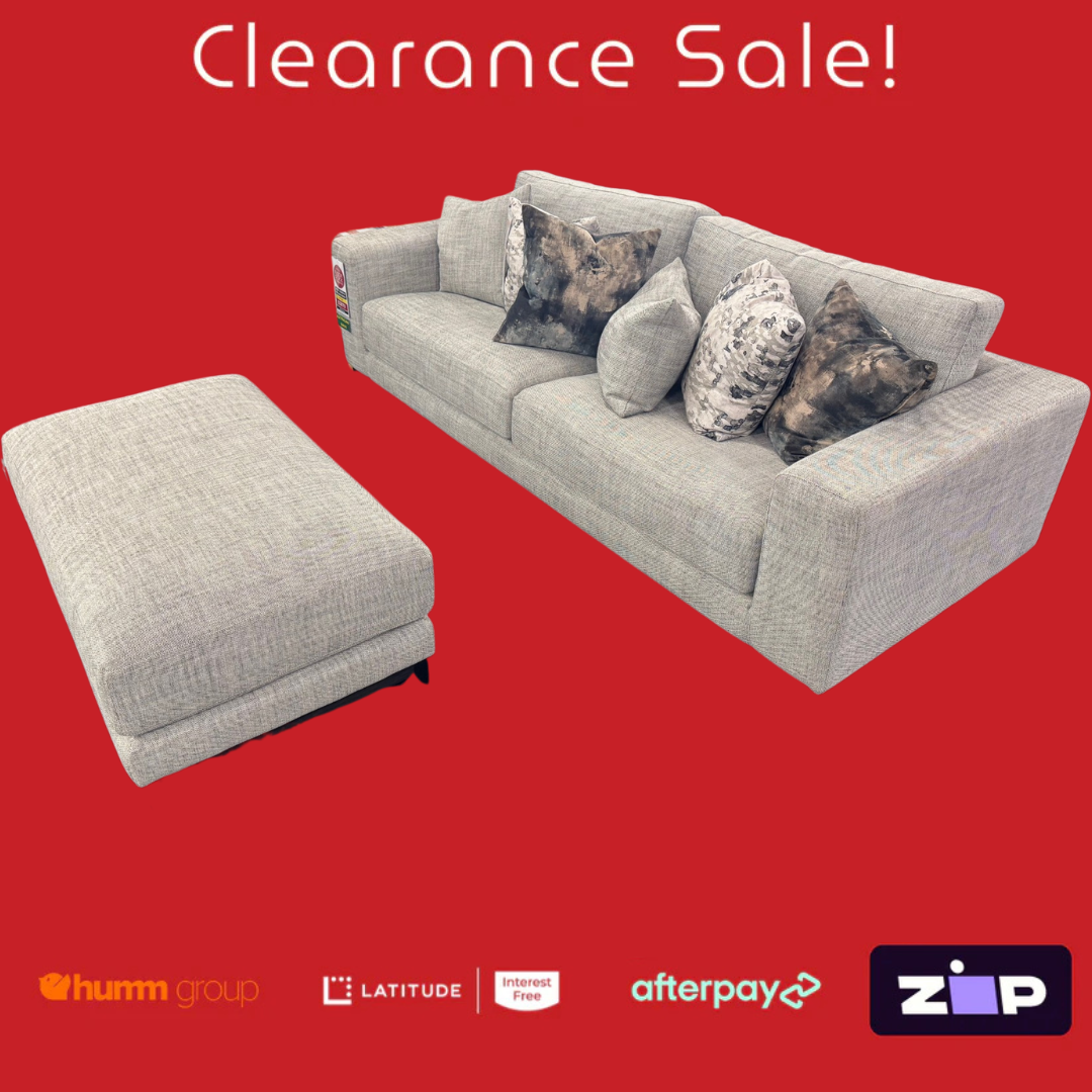 Gray sofa and ottoman with clearance sale text on a red background