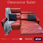 Red sectional sofa with cushions and a blanket on a red background, featuring clearance sale text and payment logos.
