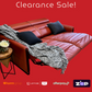 Red leather sectional sofa with a blanket and pillows on a red background, featuring clearance sale text and payment logos.