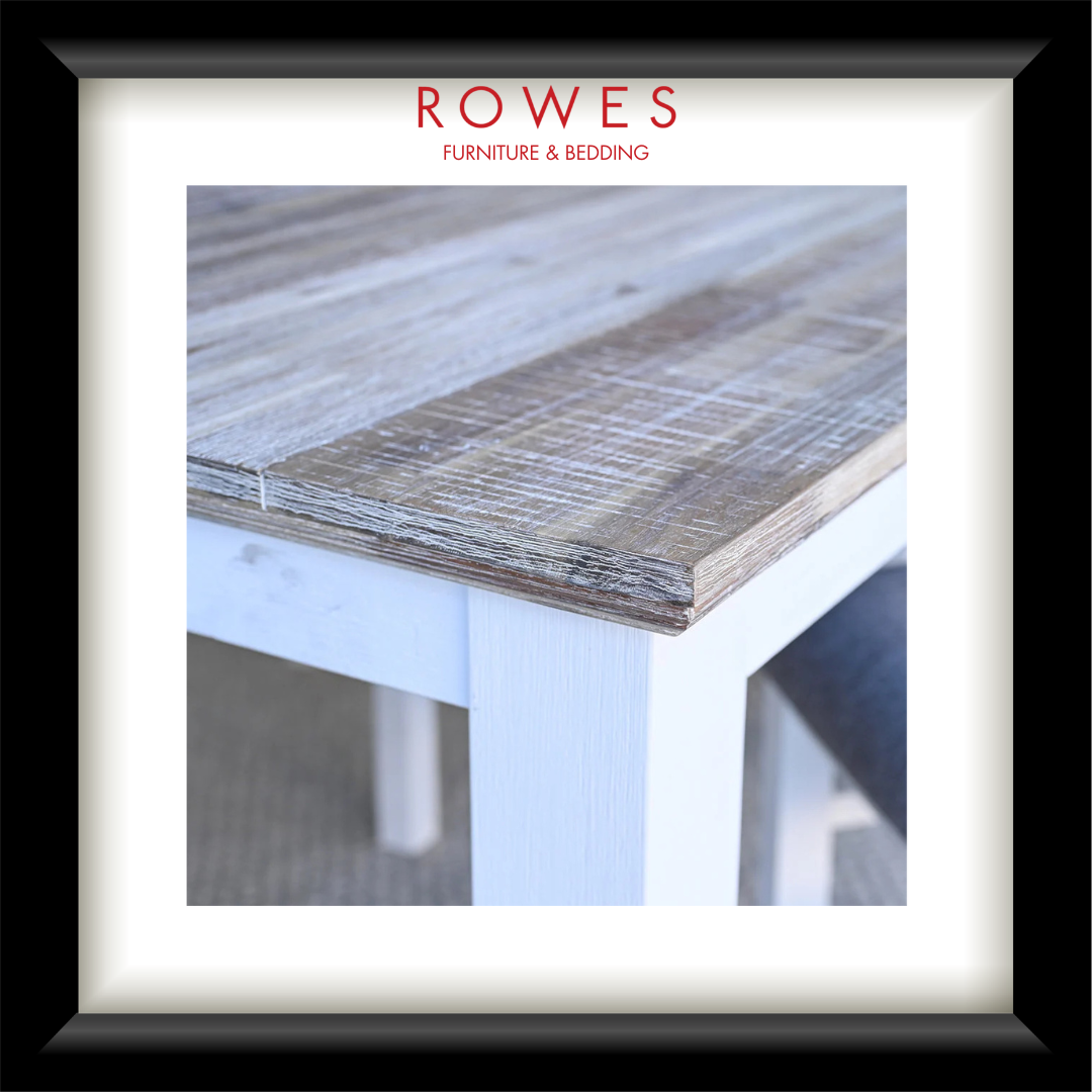A framed product display featuring a close-up photograph of a rustic wooden tabletop corner with a white painted frame, surrounded by a white mat and a black frame. The brand name 'ROWES FURNITURE & BEDDING' is printed in red at the top.