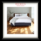 Bedroom with a bed and nightstands, featuring Rowes Furniture & Bedding logo.